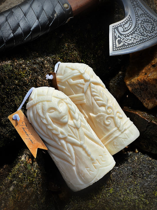 Odin and Freyja Norse candles with Viking axe on mossy rock — Fyrda Candle handmade mythology decor