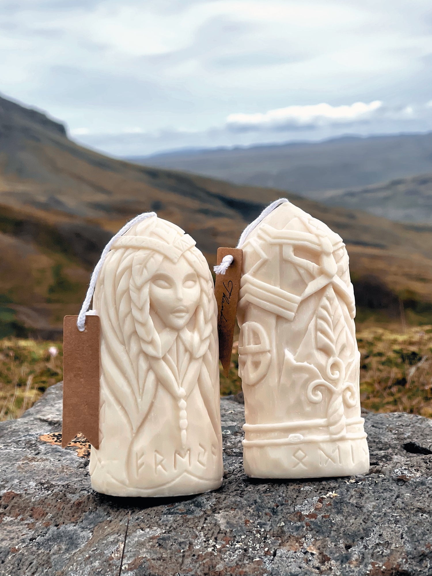 Odin and Freyja carved soy wax candles — Sacred Duality set by Fyrda Candle, photographed in Nordic landscape