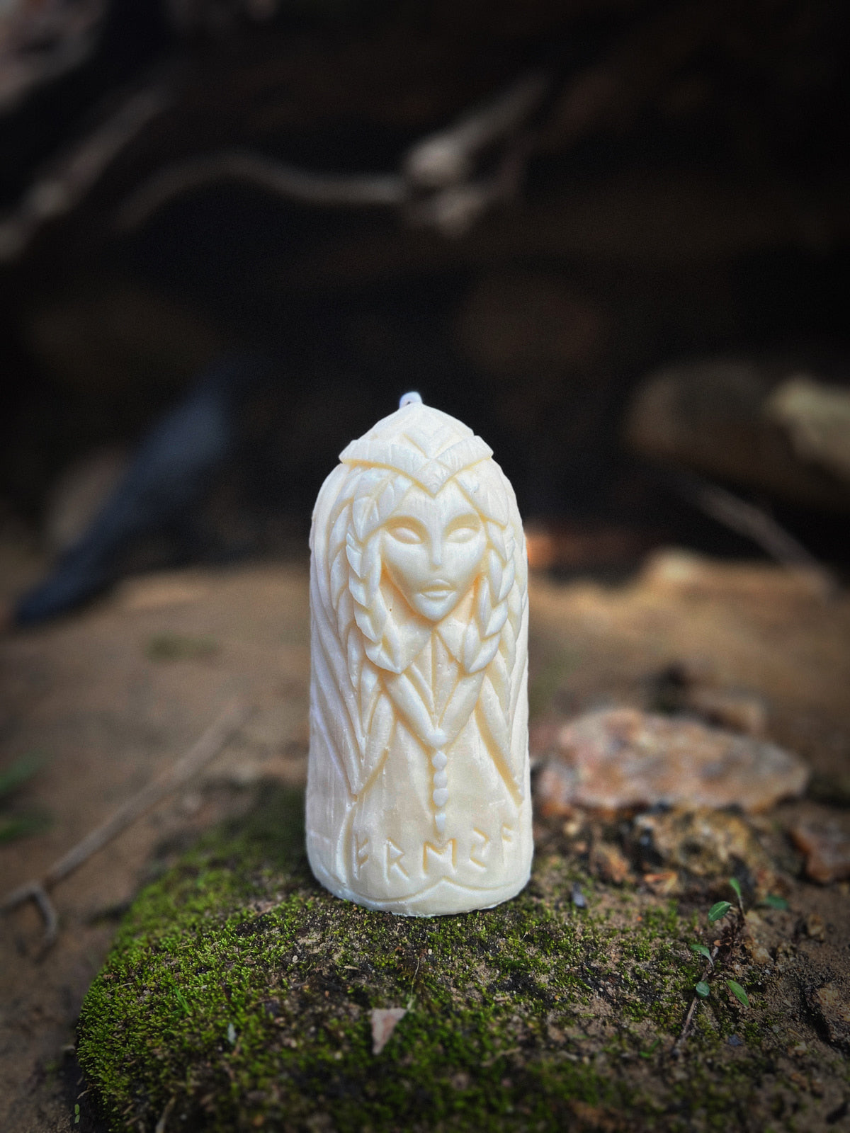 Close-up of Freya handmade candle on moss — inspired by Norse mythology