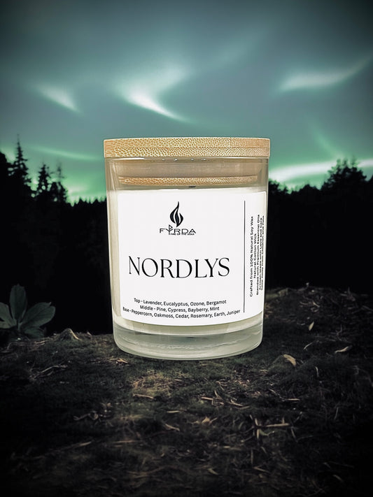 Nordlys soy candle by Fyrda with northern lights background — inspired by Arctic sky and forest magic